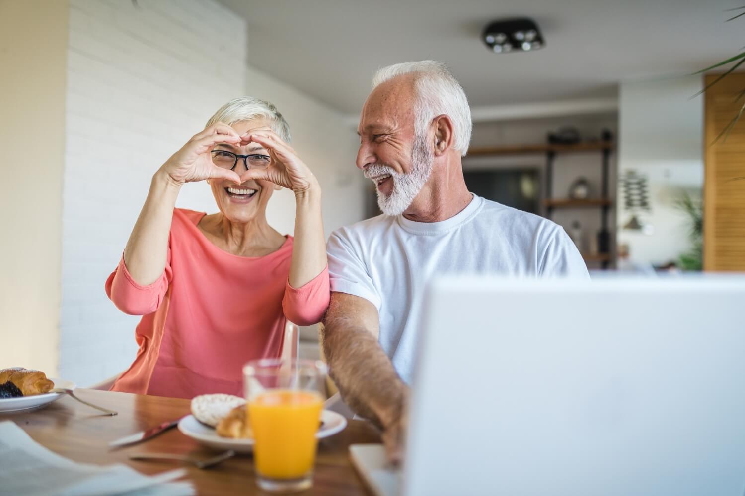 A senior couple eat breakfast after they check their heart health